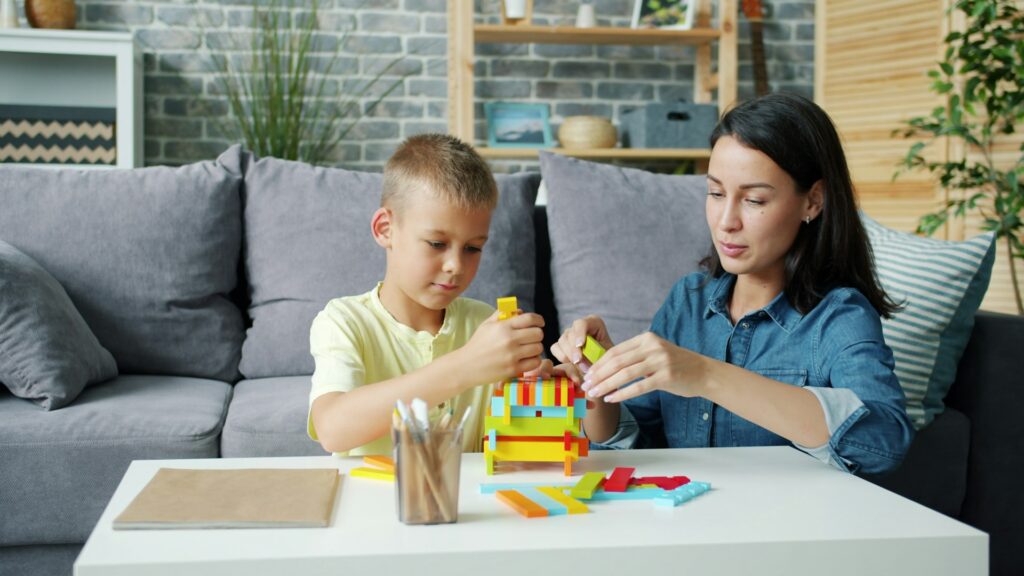 Child with autism building communication skills with a BCBA during ABA therapy in Colorado Springs